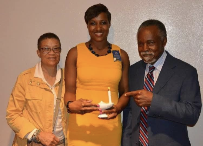 Zita at her nursing pinning ceremony with both of her parents