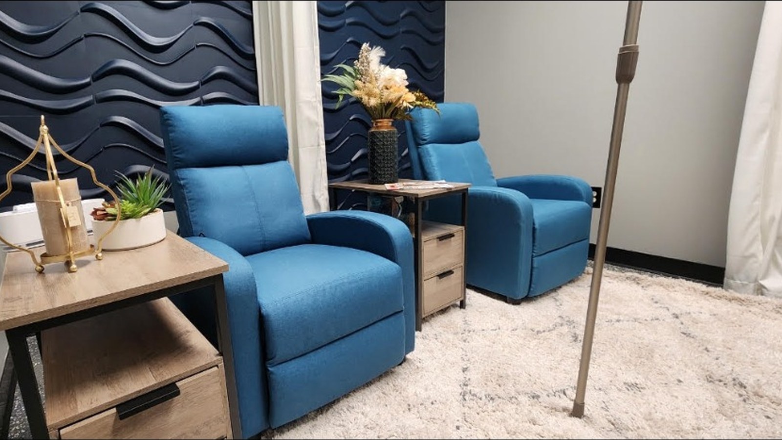 REVAMP Wellness Center for Men treatment room with blue recliner chairs for IV therapy and wellness injections in Jacksonville, Florida